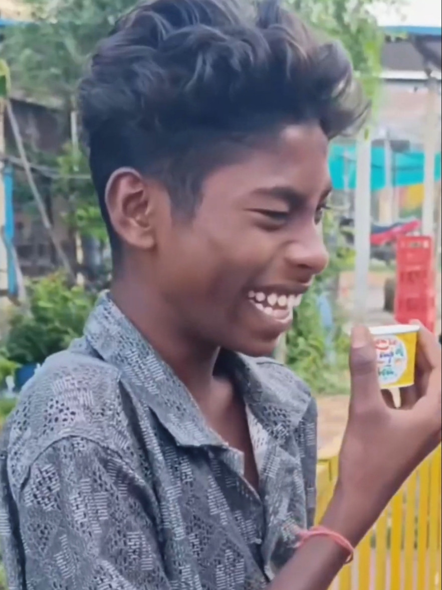 Boy Laughing With Tea Cup