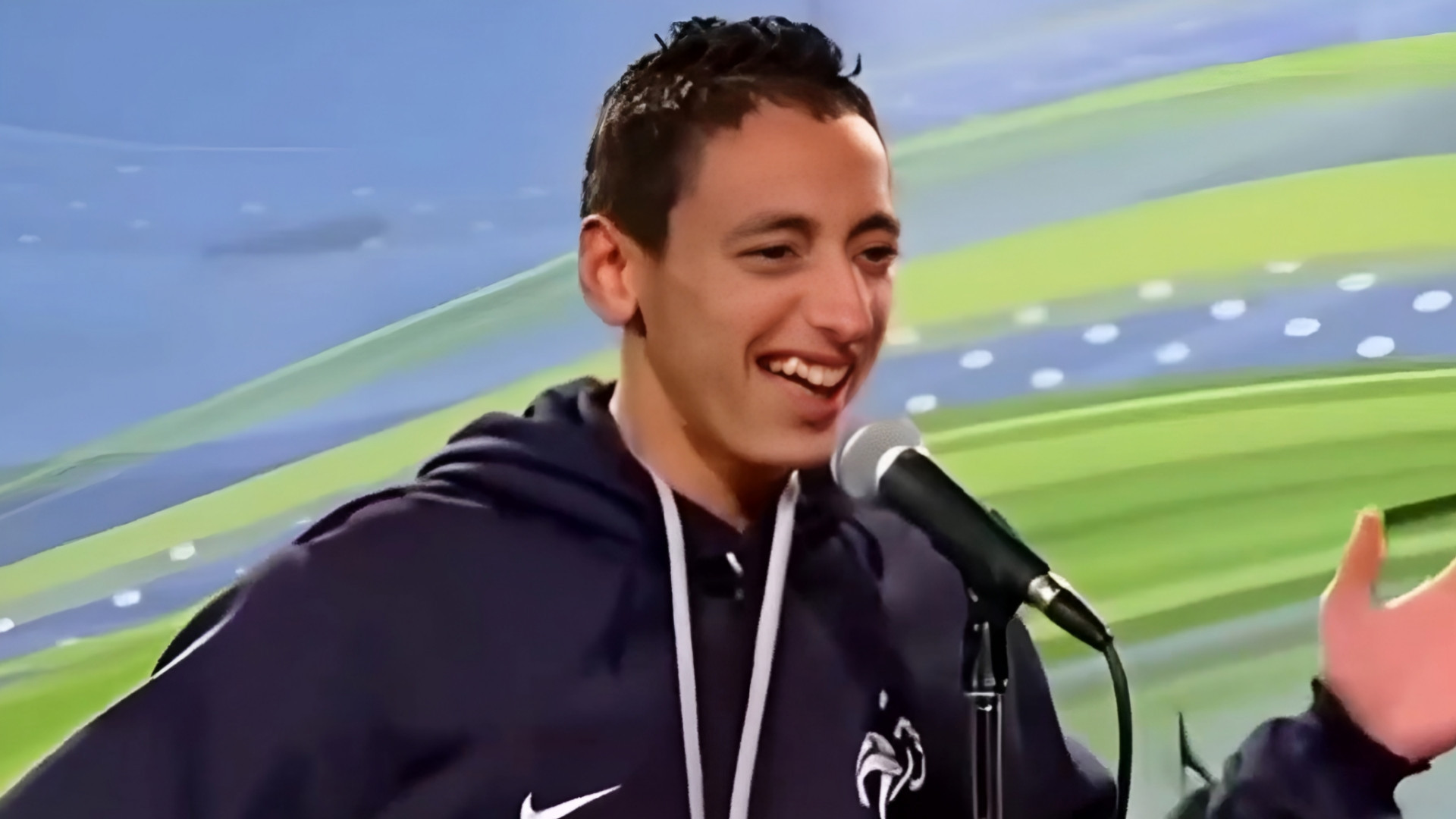 Redouane Laughing While Singing on Mic Meme Template
